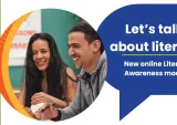 Two people laughing next to a banner that says "Let's talk about literacy."